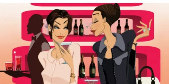 Two women talking at a cocktail bar